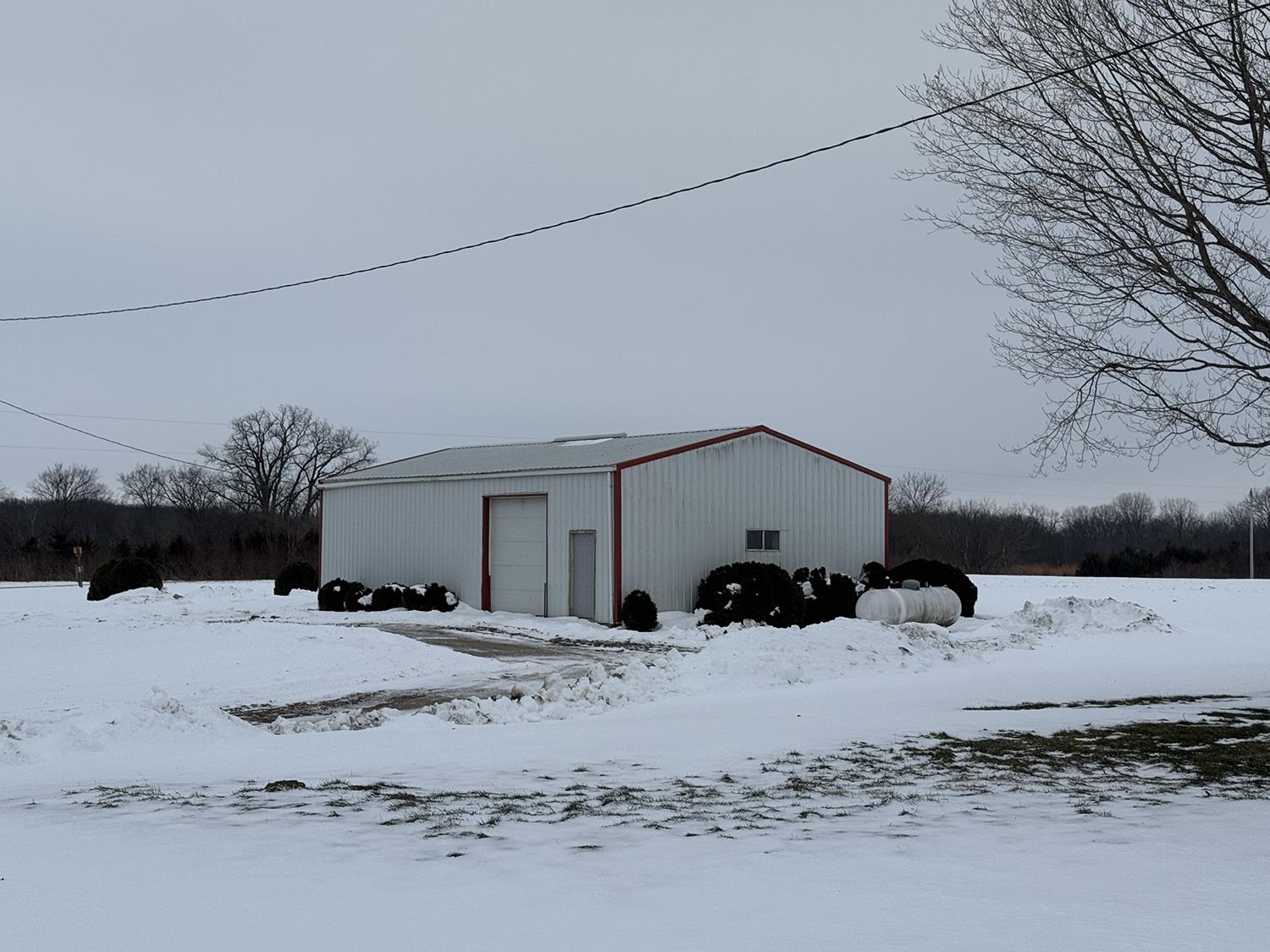 18341 Pleasant Hill Road Mount Carroll, IL 61053 - Photo 7 of 41 a view of the snow on the road