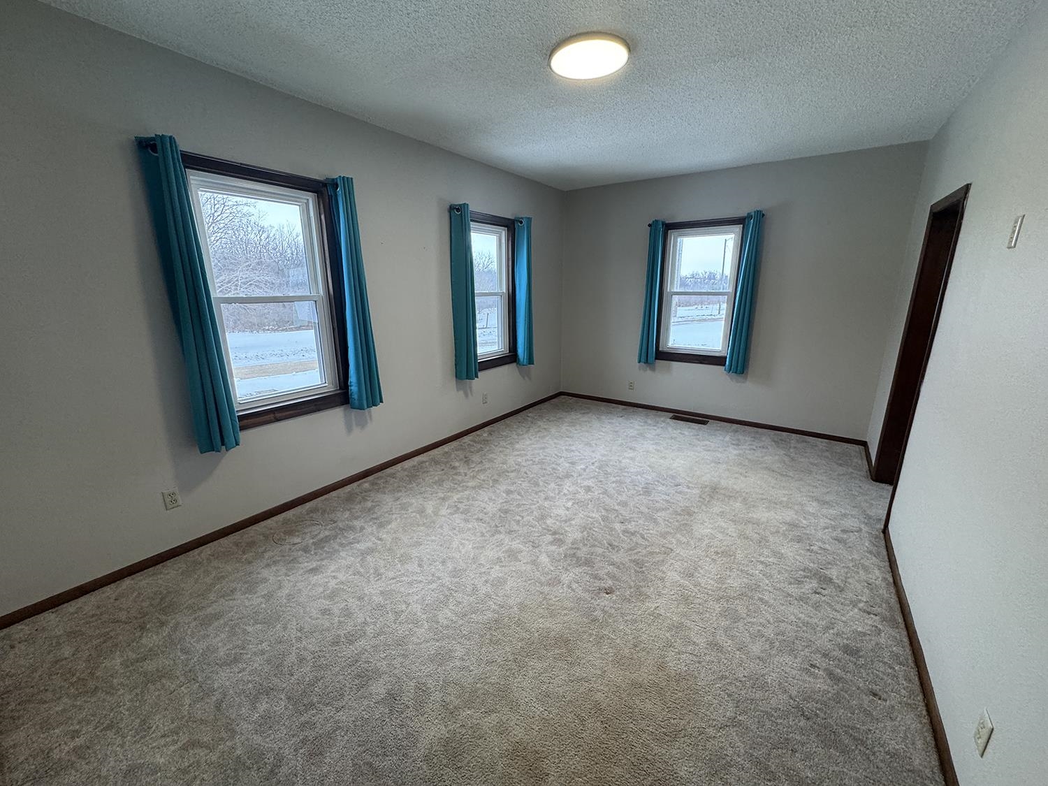18341 Pleasant Hill Road Mount Carroll, IL 61053 - Photo 8 of 41 a view of an empty room with windows