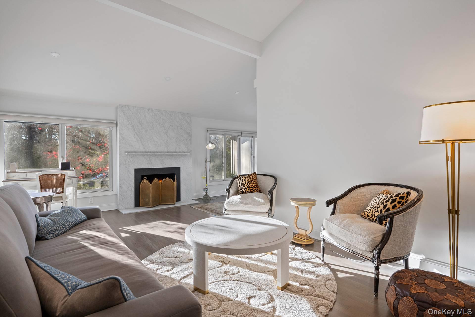 1824 Majors Path Southampton, NY 11968 - Photo 11 of 28 a view of a livingroom with furniture and a fireplace