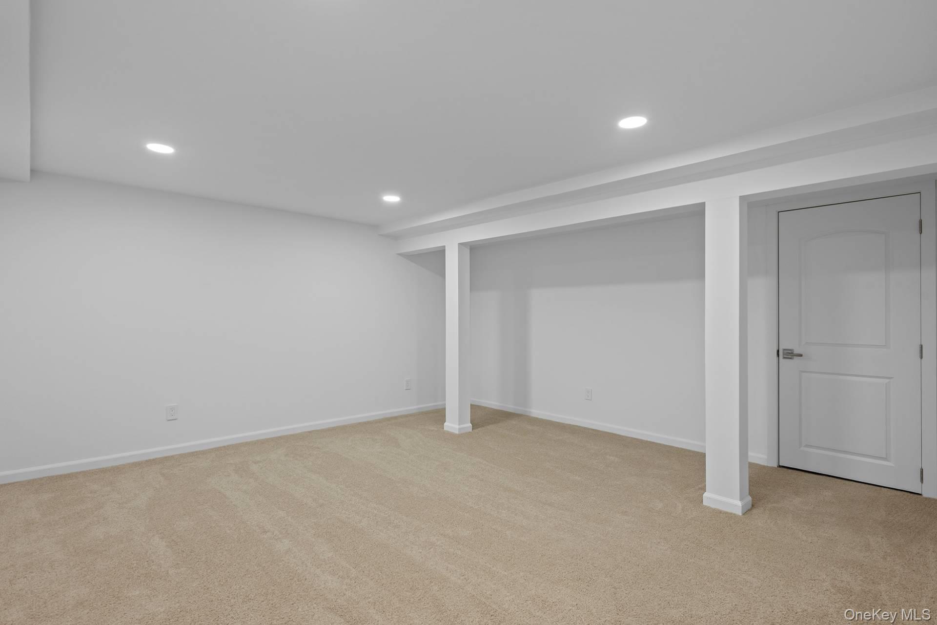 1824 Majors Path Southampton, NY 11968 - Photo 27 of 28 Finished basement with recessed lighting and light colored carpet