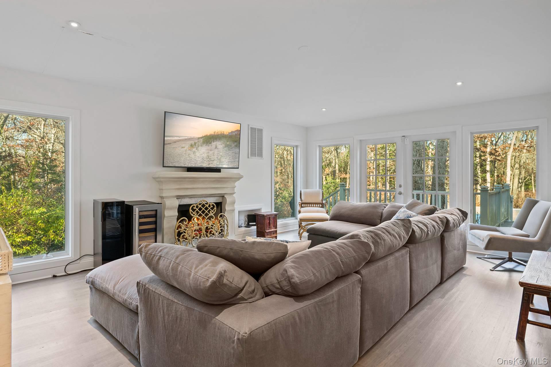 1824 Majors Path Southampton, NY 11968 - Photo 8 of 28 a living room with fireplace furniture and a large window