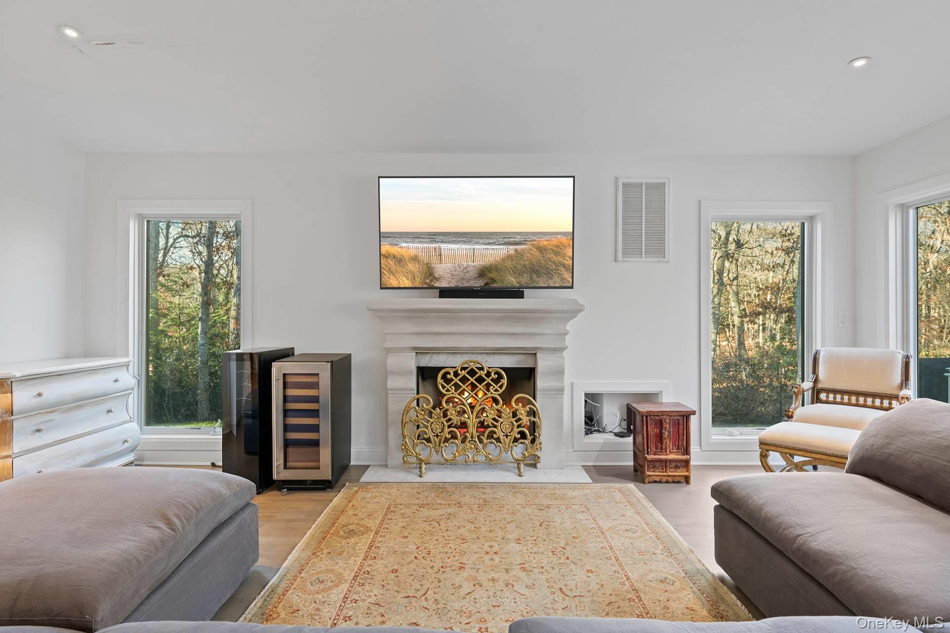 1824 Majors Path Southampton, NY 11968 - Photo 9 of 28 a living room with furniture and a fireplace