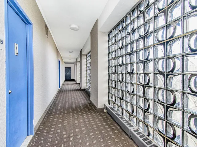 a view of a workspace with furniture and window