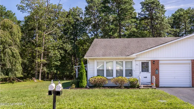 a house view with a garden space