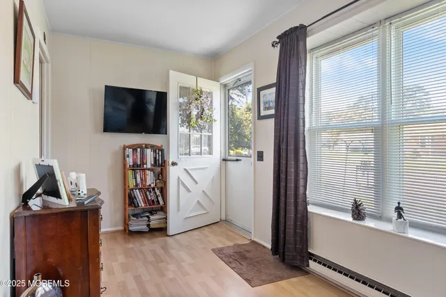 a view of a livingroom with furniture and a flat screen tv