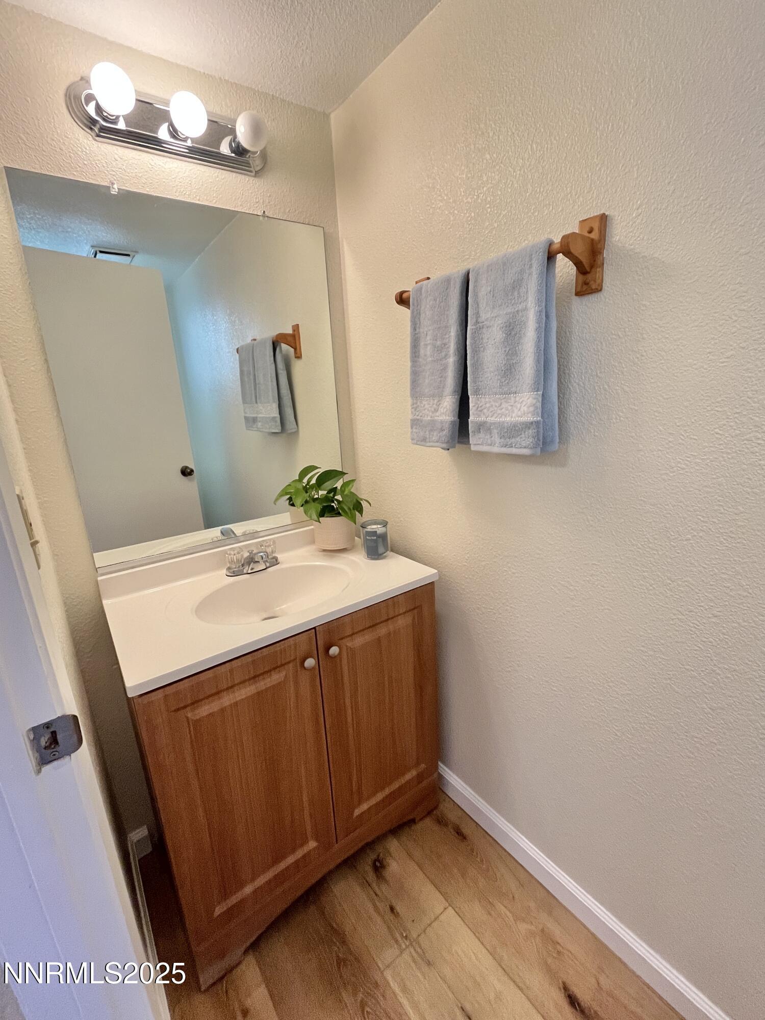 4985 West 7th Street, Unit 16 Reno, NV 89503 - Photo 5 of 10 a bathroom with a sink and a mirror