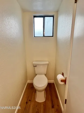 a white toilet sitting in a bathroom