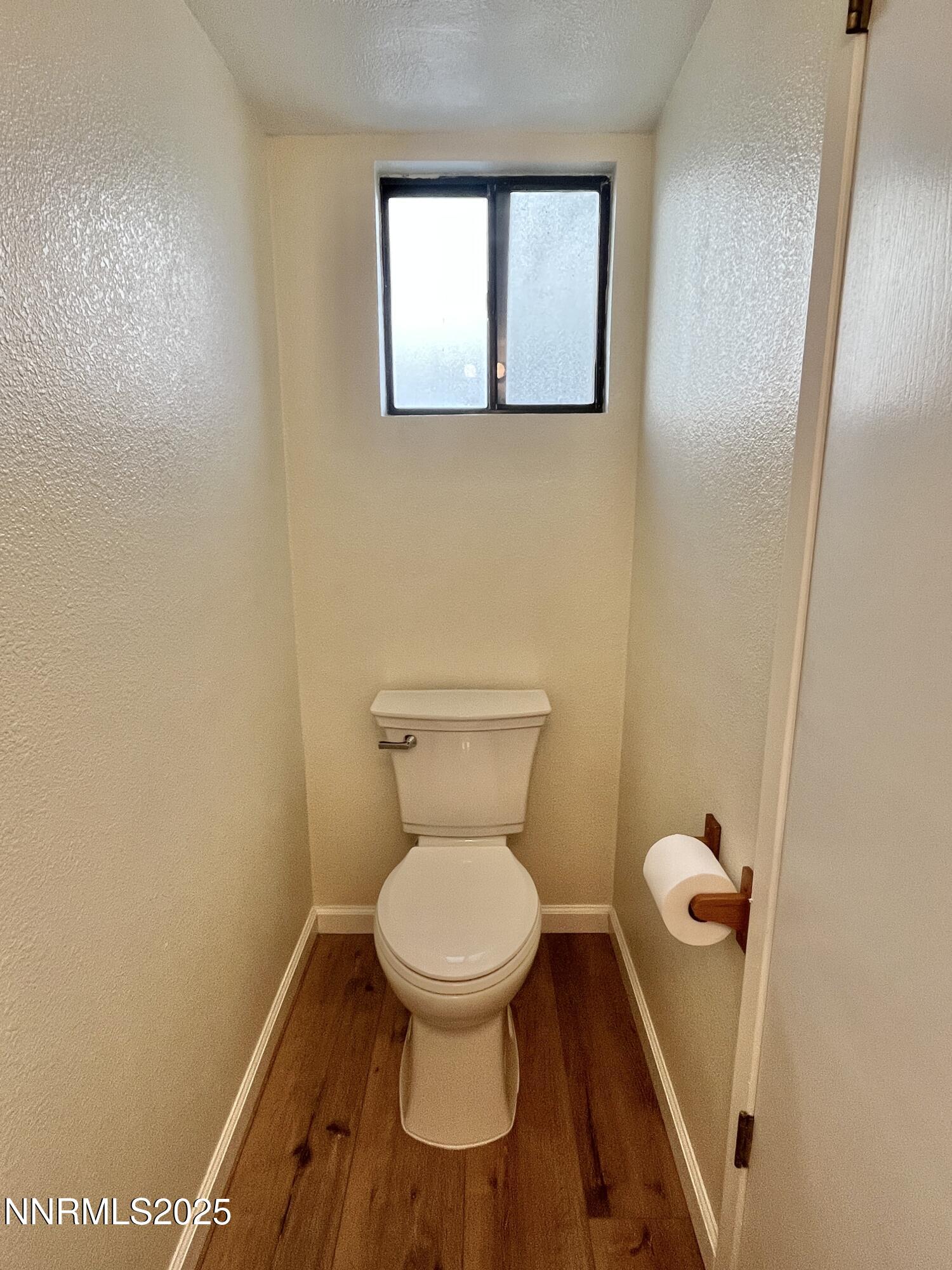 4985 West 7th Street, Unit 16 Reno, NV 89503 - Photo 6 of 10 a white toilet sitting in a bathroom