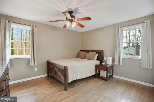 a bed room with a bed and a chandelier
