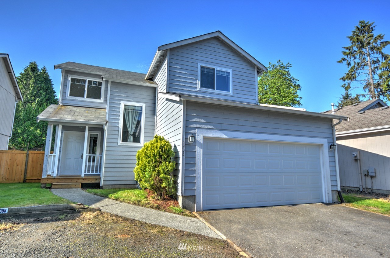 1308 Golf Club Road Southeast Lacey, WA 98503 - Photo 1 of 23 a view of a house with a yard and plants