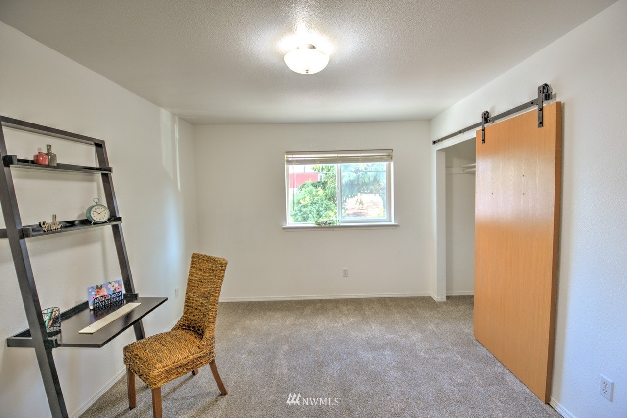 1308 Golf Club Road Southeast Lacey, WA 98503 - Photo 20 of 23 a view of a workspace with furniture and a window