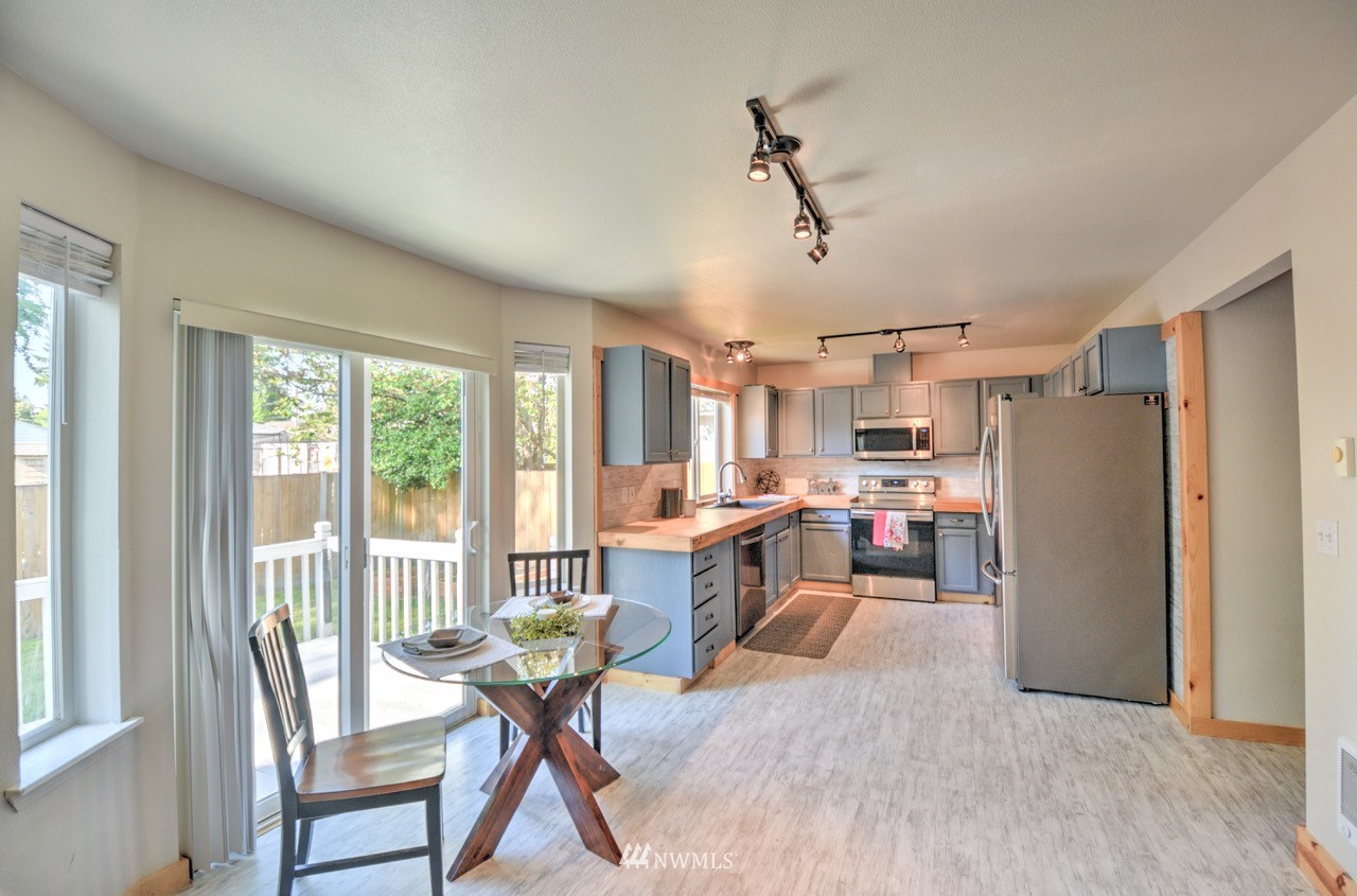 1308 Golf Club Road Southeast Lacey, WA 98503 - Photo 5 of 23 a living room with furniture and a window