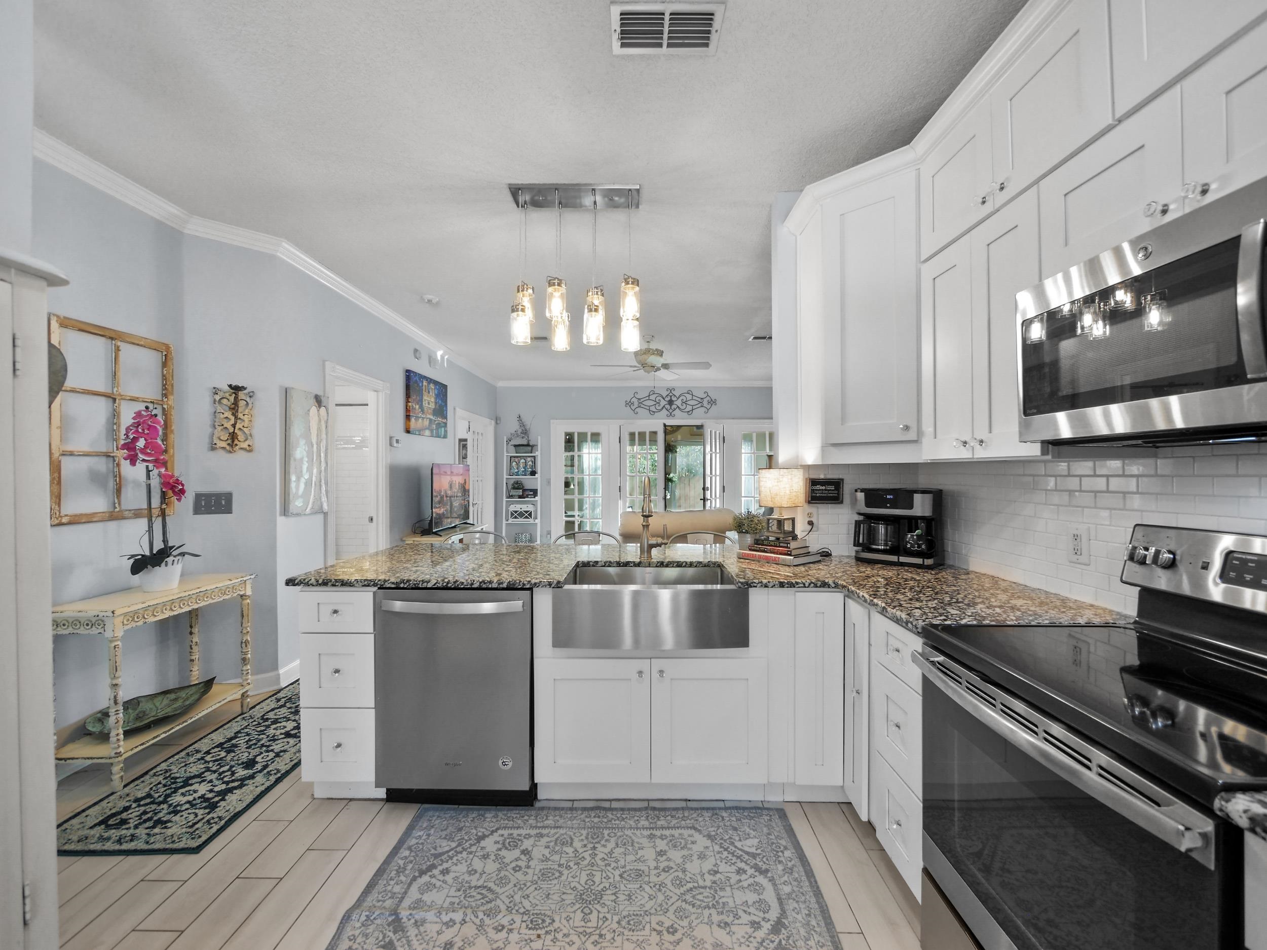 84 Seascape Circle St. Augustine, FL 32080 - Photo 12 of 34 a kitchen with stainless steel appliances granite countertop a stove and a sink