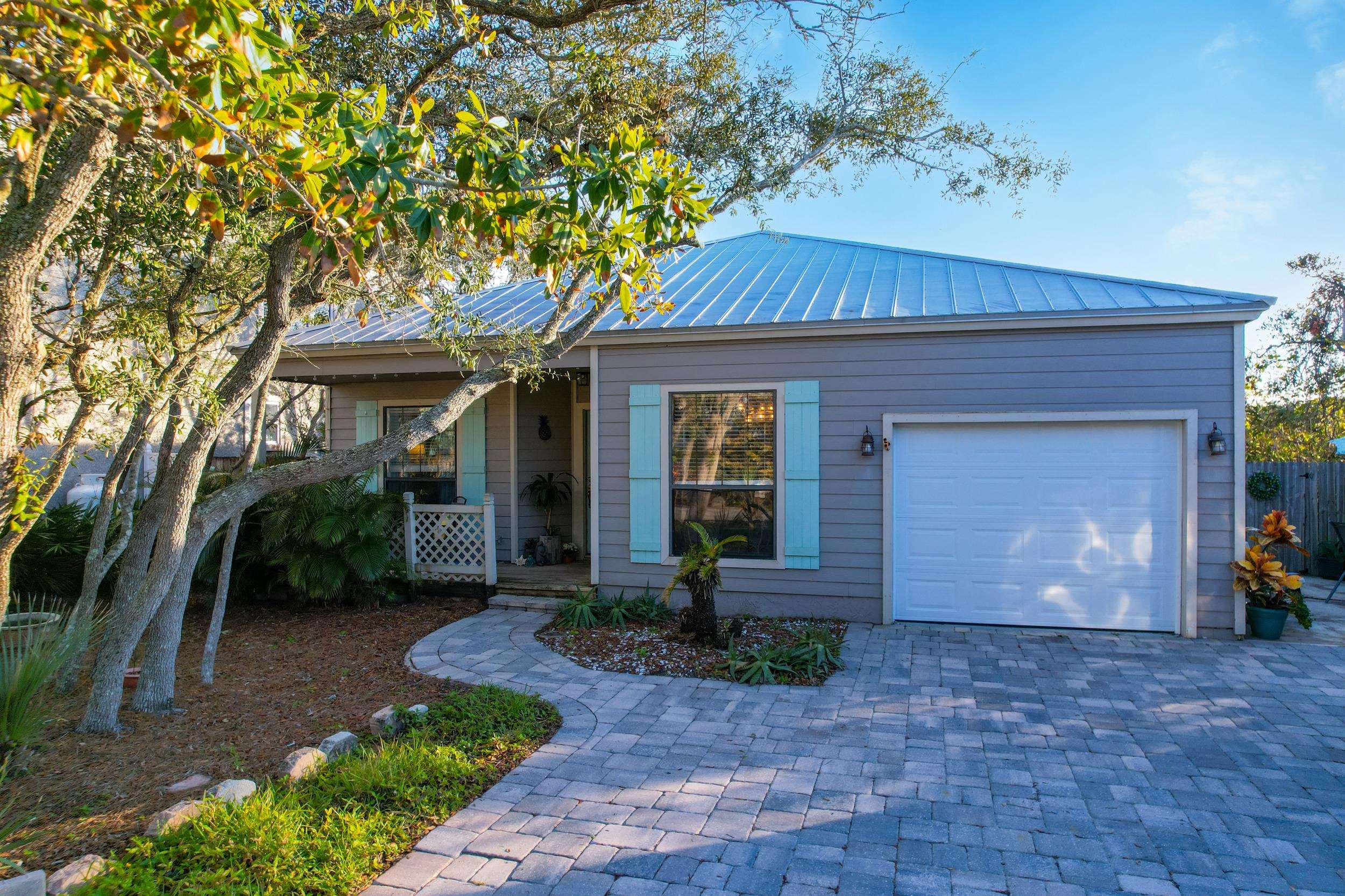 84 Seascape Circle St. Augustine, FL 32080 - Photo 2 of 34 a front view of a house with garden