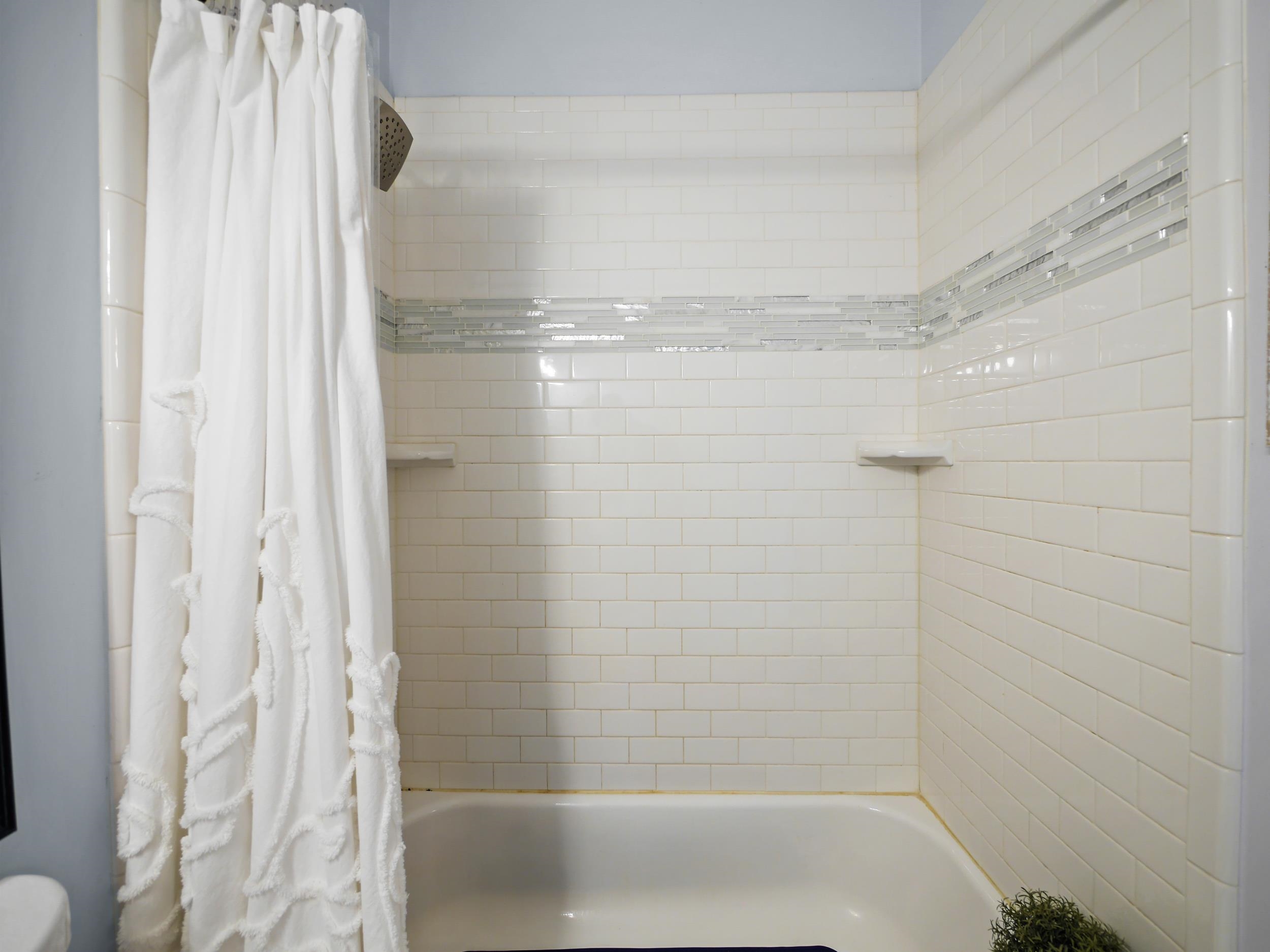 84 Seascape Circle St. Augustine, FL 32080 - Photo 22 of 34 a bathroom with a glass shower door