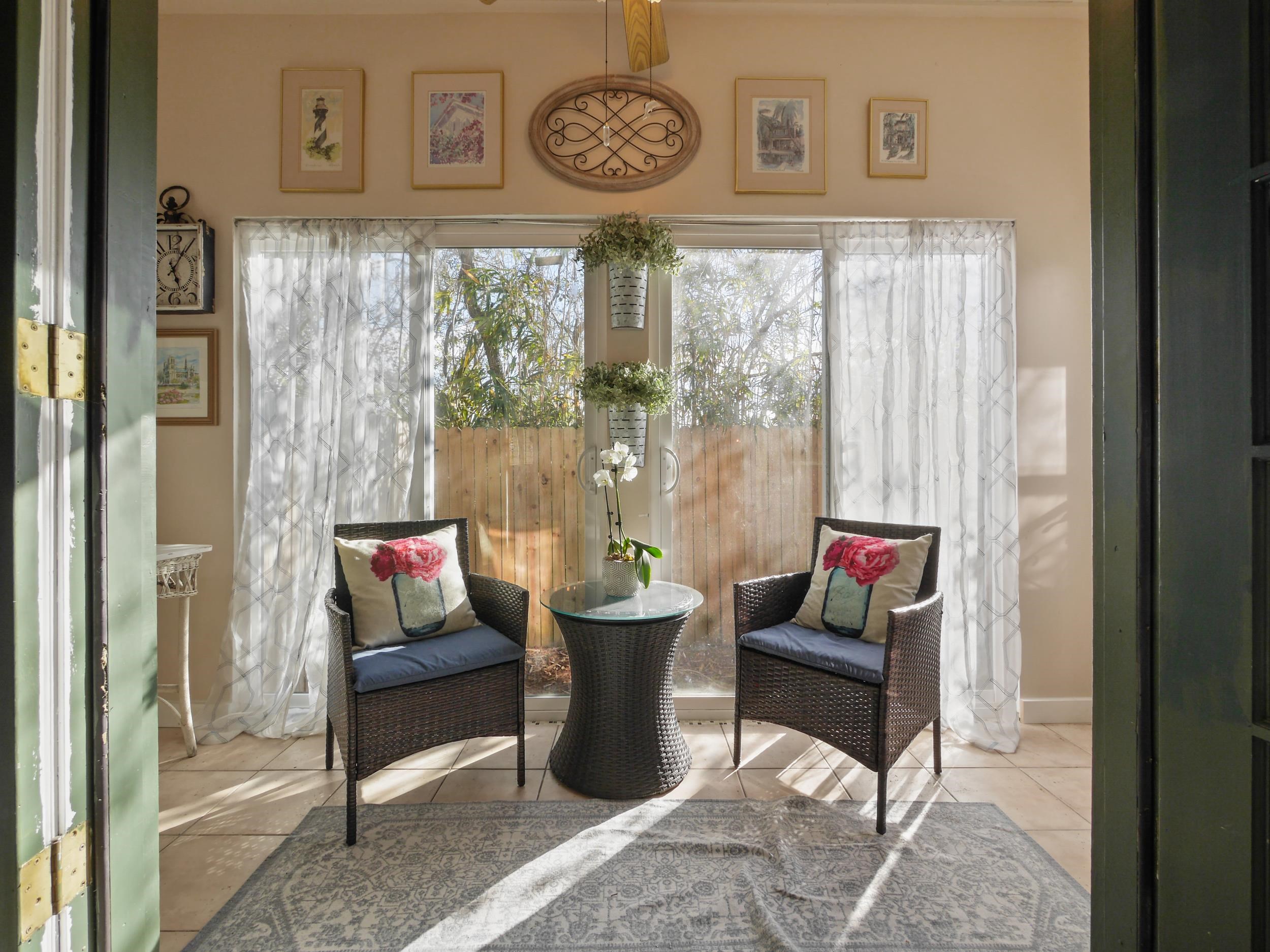 84 Seascape Circle St. Augustine, FL 32080 - Photo 24 of 34 a living room with furniture and a clock