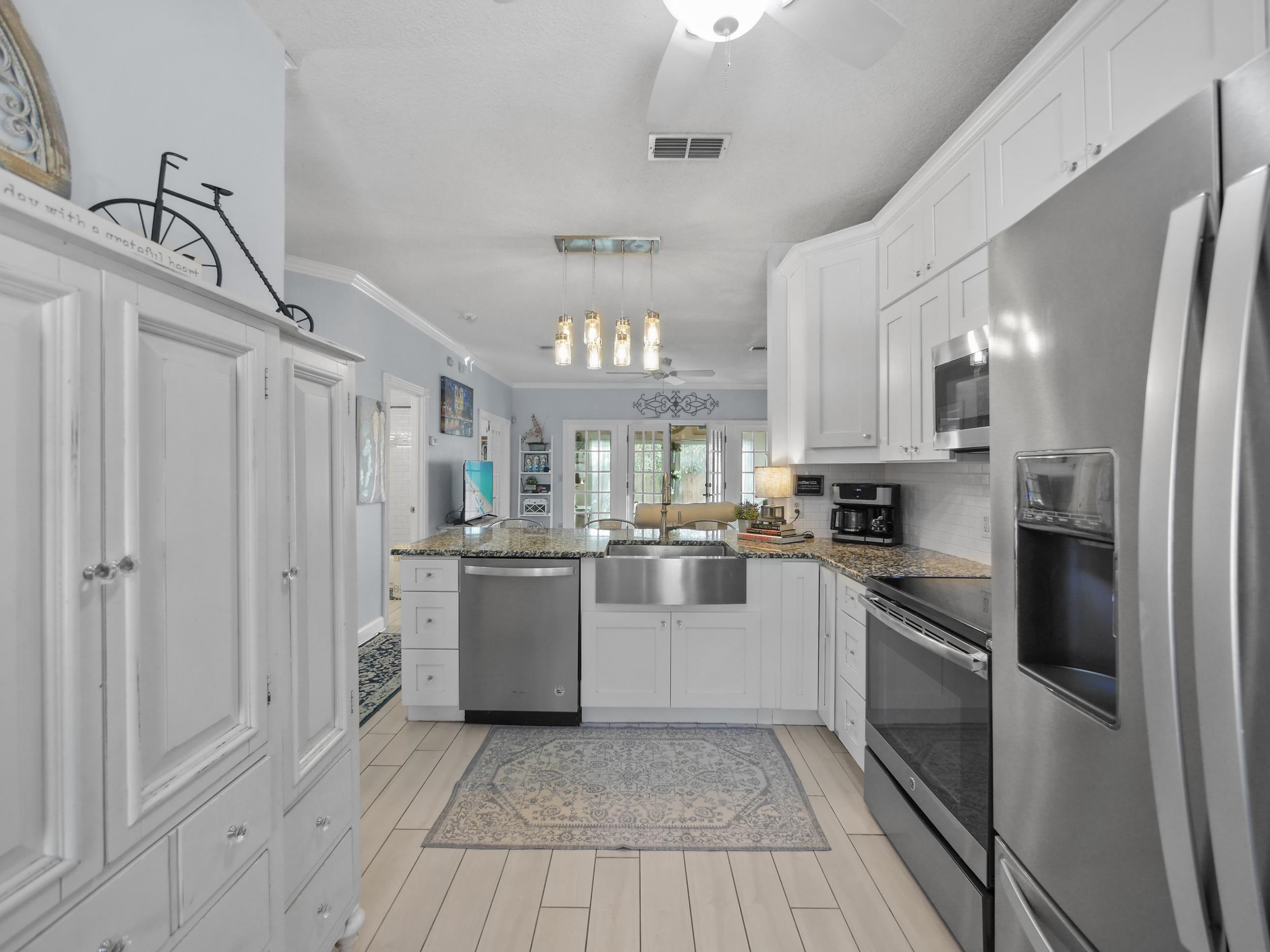 84 Seascape Circle St. Augustine, FL 32080 - Photo 9 of 34 a kitchen with cabinets and stainless steel appliances