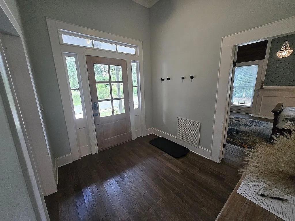 151 South Jackson Street Hartwell, GA 30643 - Photo 2 of 17 a view of a livingroom with wooden floor and a window