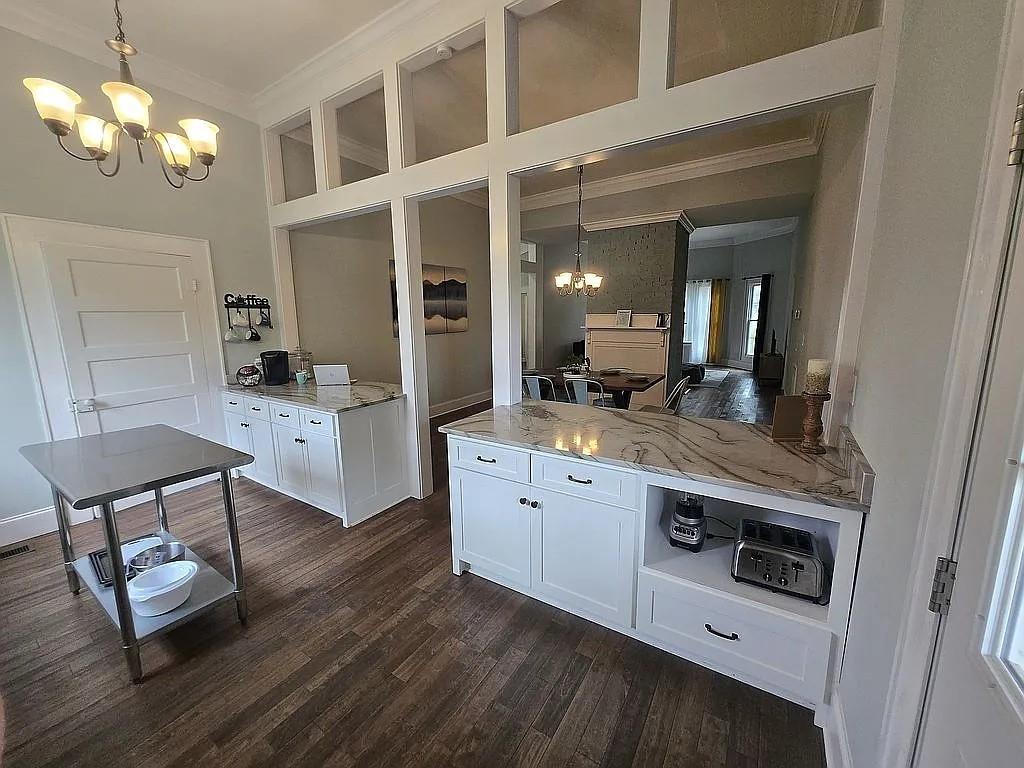 151 South Jackson Street Hartwell, GA 30643 - Photo 6 of 17 a kitchen with stainless steel appliances granite countertop a stove and cabinets