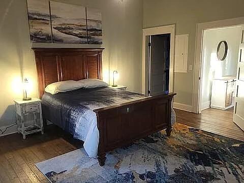 151 South Jackson Street Hartwell, GA 30643 - Photo 9 of 17 a spacious bedroom with a bed and a dresser