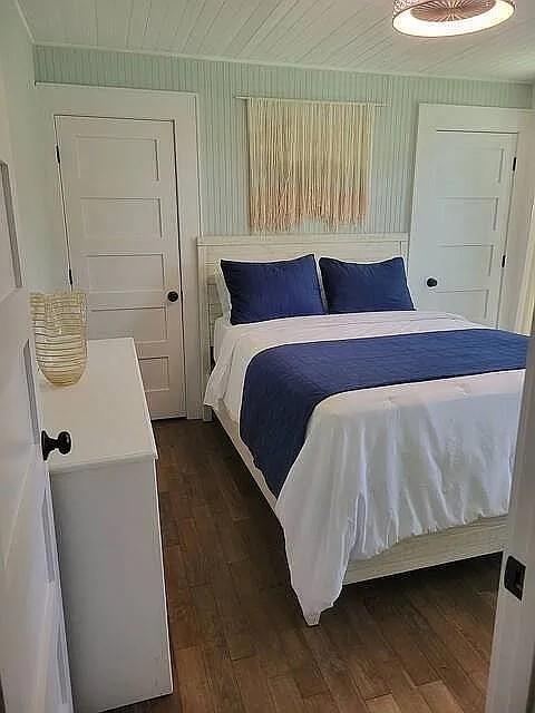 151 South Jackson Street Hartwell, GA 30643 - Photo 10 of 17 a bedroom with a bed and wooden floor