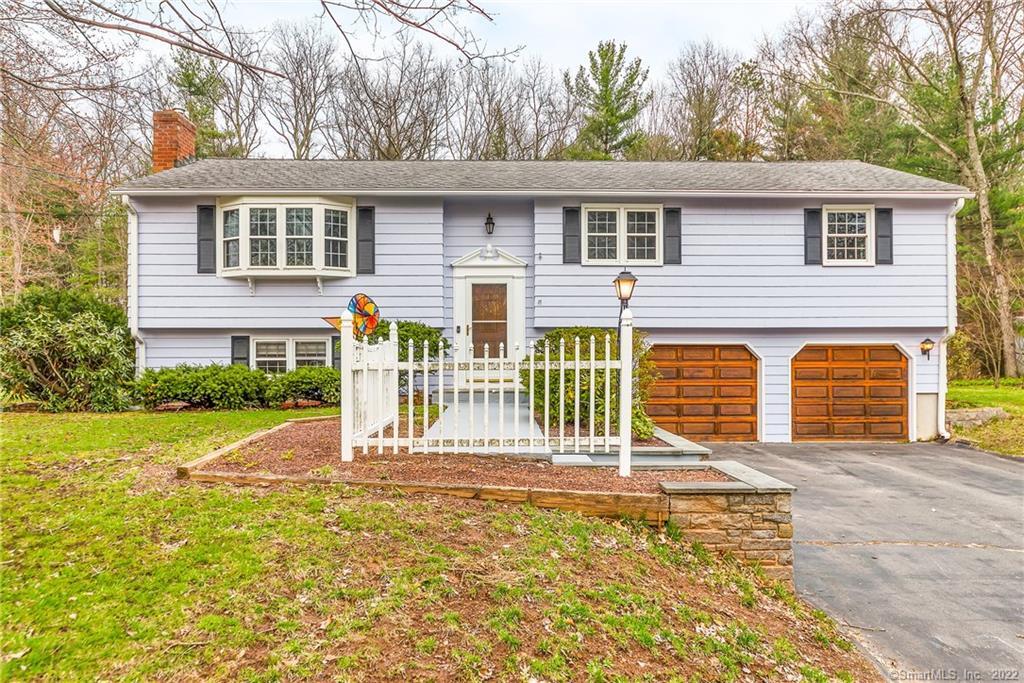 61 Brookview Road Windsor, CT 06095 - Photo 1 of 1 a front view of a house with a yard