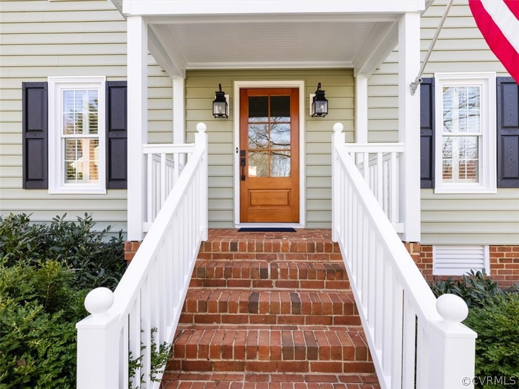 513 Greene Ridge Road Henrico, VA 23229 - Photo 3 of 36 Covered front entrance with elegant brickwork, PVC railings and NEW front door.