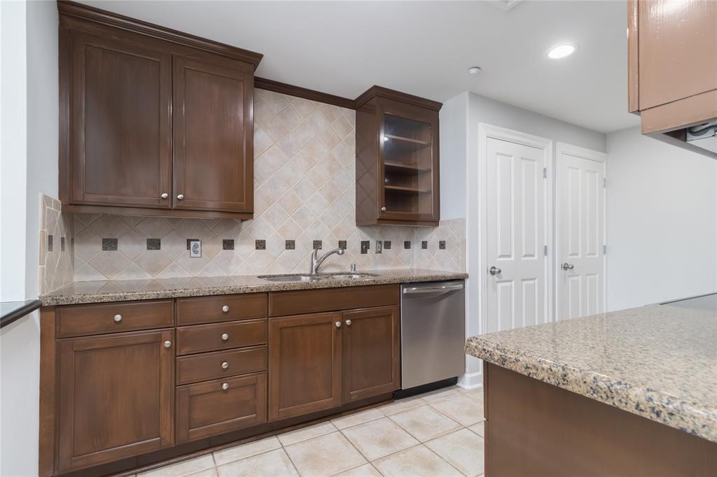 914 Main Street, Unit 1503 Houston, TX 77002 - Photo 5 of 33 a bathroom with a granite countertop sink and a mirror
