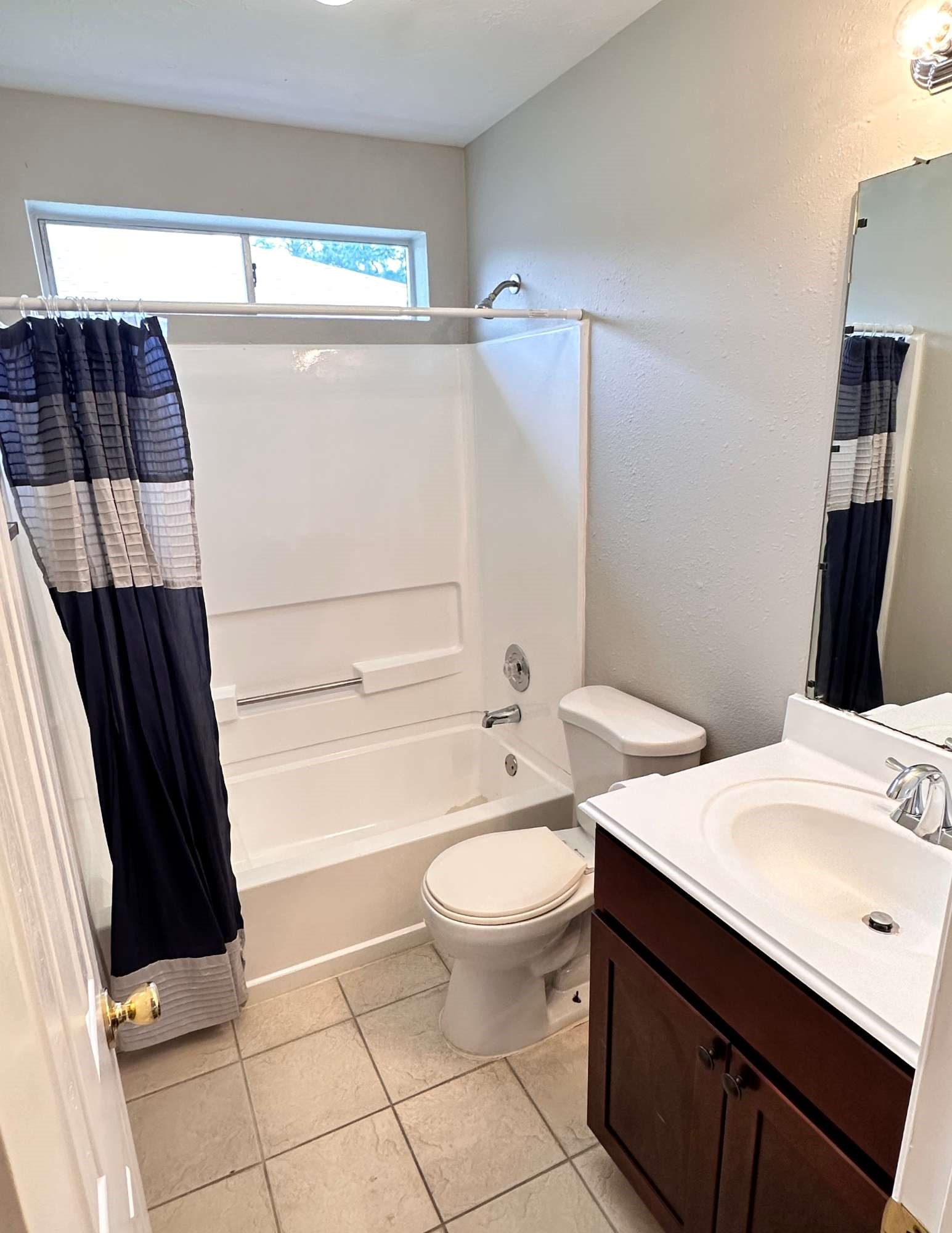 22707 Bridgewater Drive Spring, TX 77373 - Photo 9 of 11 a bathroom with a sink a toilet and shower