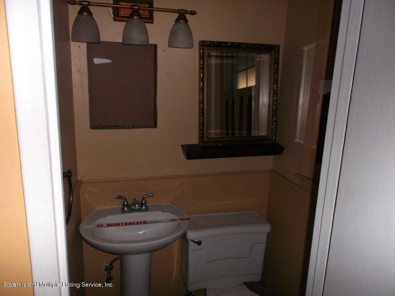 1 Sarno Street Colonia, NJ 07067 - Photo 26 of 30 a bathroom with a sink a toilet and mirror