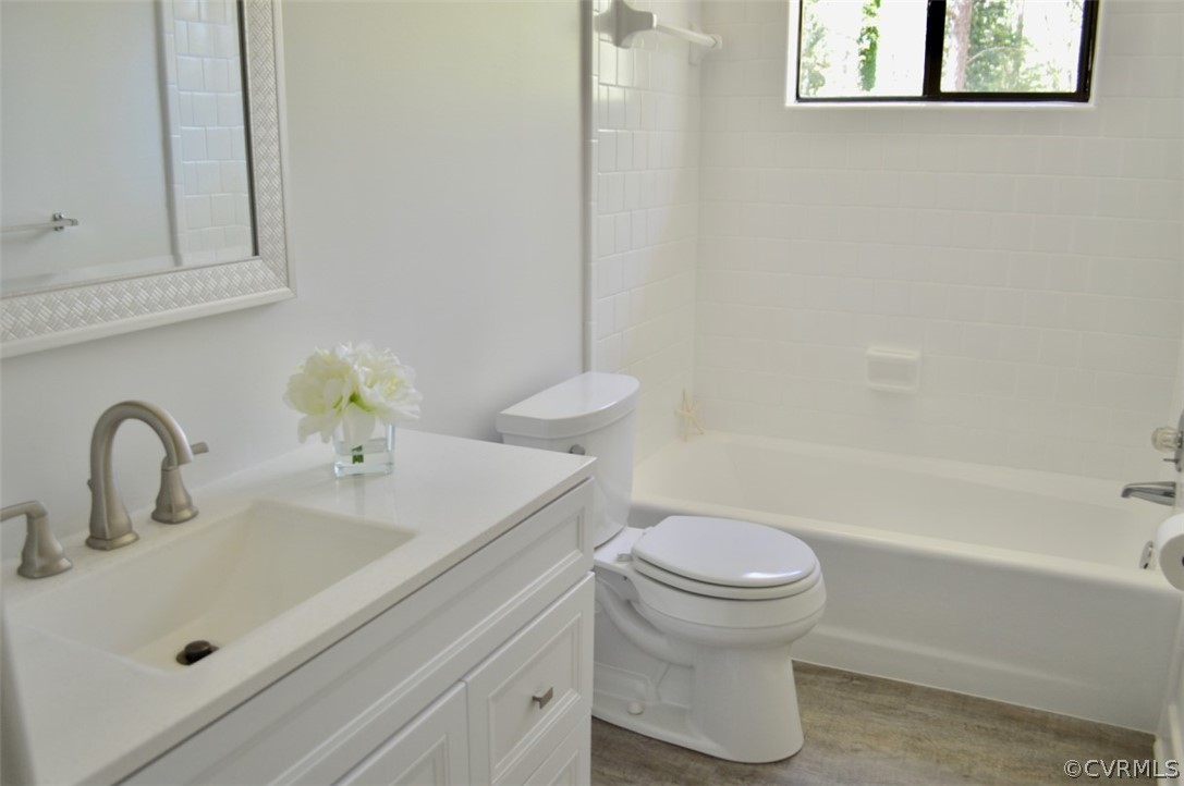 7442 Drexelbrook Road Chesterfield, VA 23832 - Photo 15 of 24 a bathroom with a sink a toilet and a bathtub