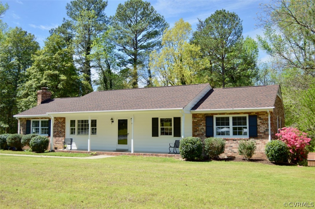 7442 Drexelbrook Road Chesterfield, VA 23832 - Photo 3 of 24 a front view of a house with a garden