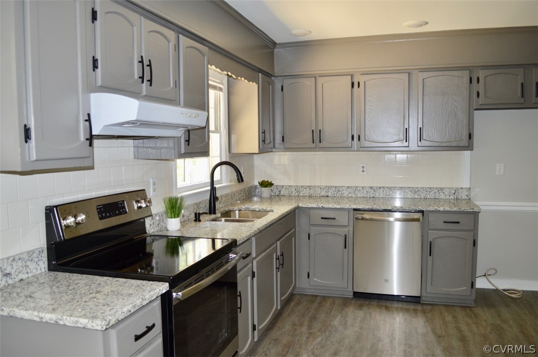 7442 Drexelbrook Road Chesterfield, VA 23832 - Photo 10 of 24 a kitchen with stainless steel appliances granite countertop a sink stove and refrigerator