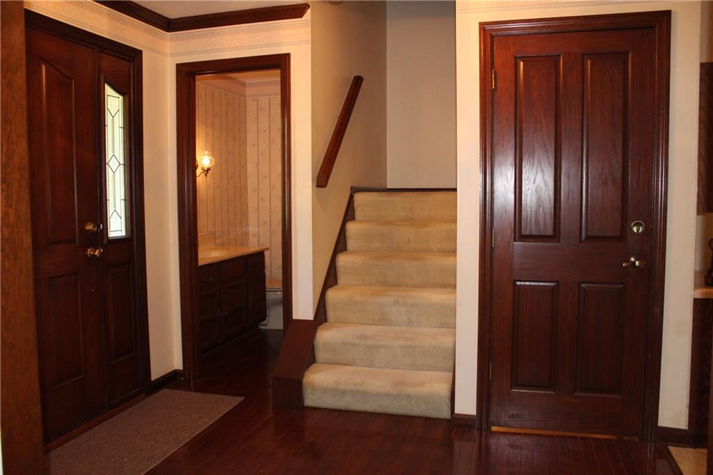 1668 Little Meadow Road Pittsburgh, PA 15241 - Photo 13 of 25 Front entry to powder room, stairs up and down.