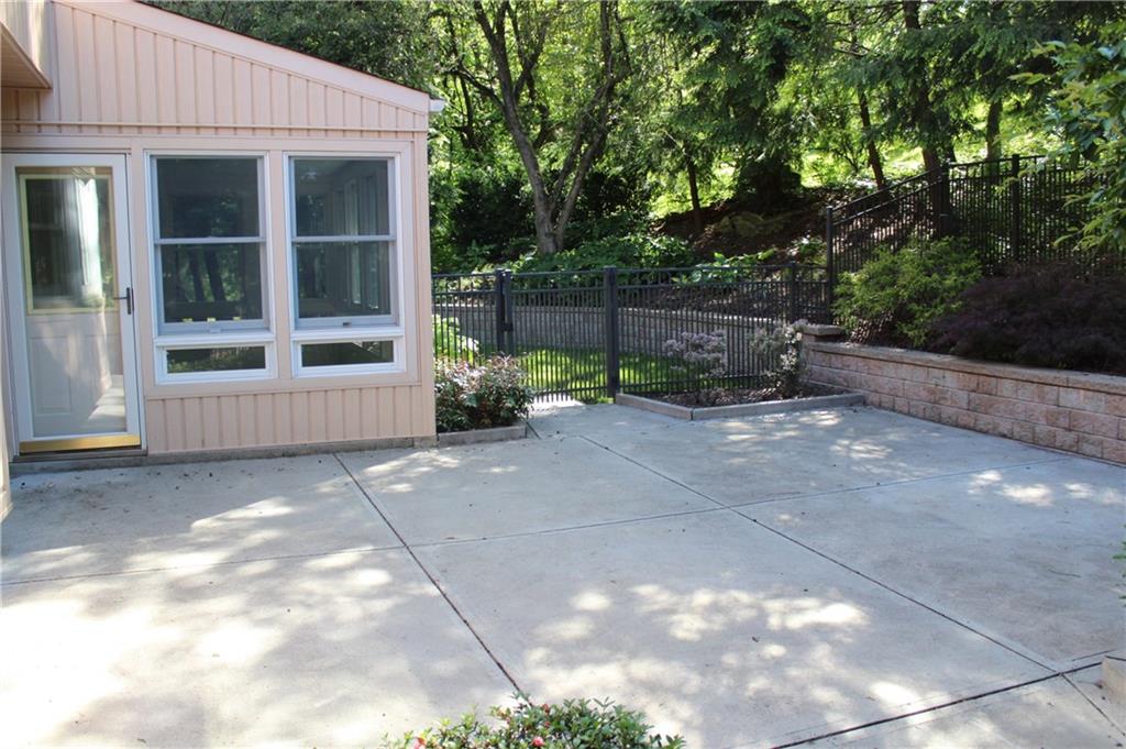1668 Little Meadow Road Pittsburgh, PA 15241 - Photo 24 of 25 Concrete patio is fenced and private located outside the sun room.