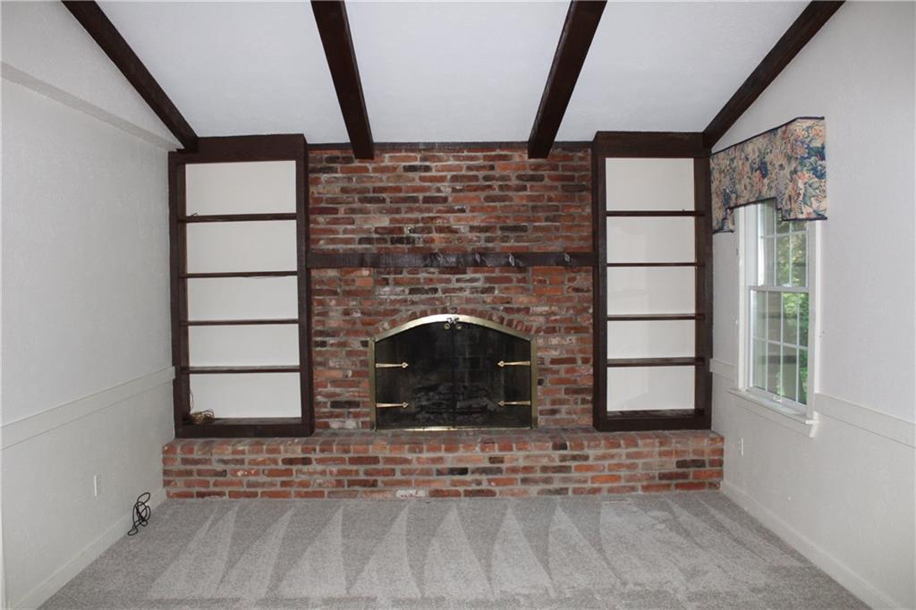 1668 Little Meadow Road Pittsburgh, PA 15241 - Photo 9 of 25 Brick, gas fireplace is flanked with shelves. Room complete with fresh paint and new carpeting.