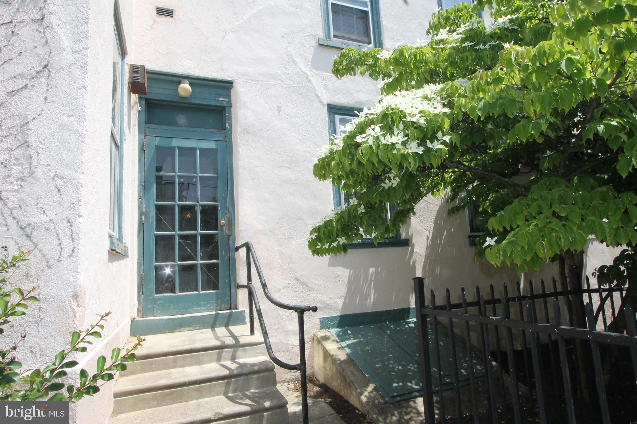 100 East Price Street, Unit 1G Philadelphia, PA 19144 - Photo 14 of 16 a view of staircase with large tree