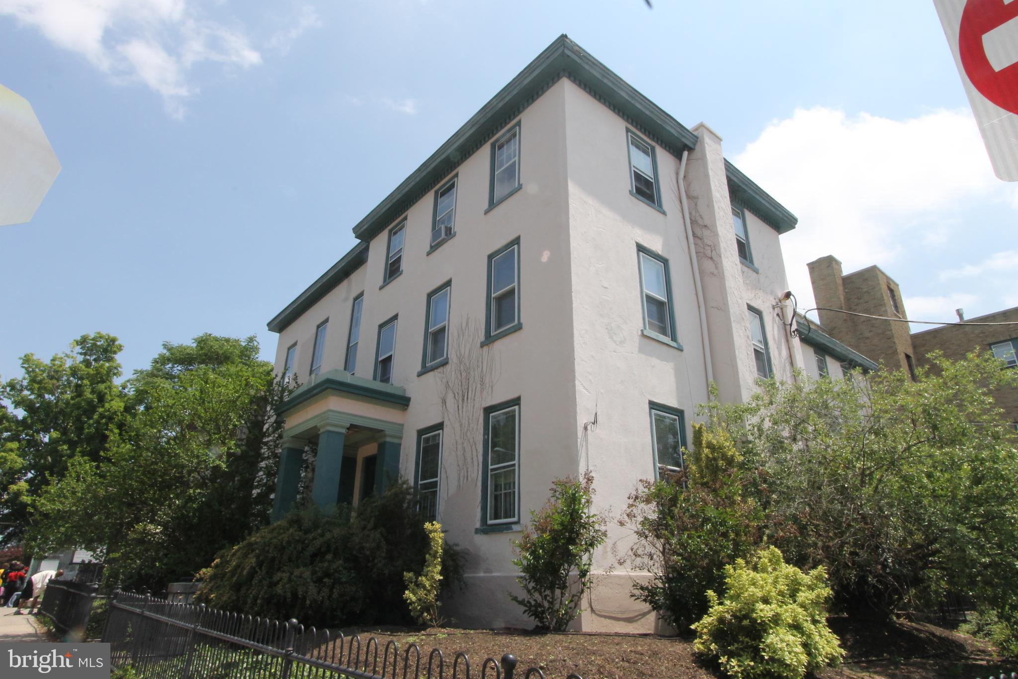 100 East Price Street, Unit 1G Philadelphia, PA 19144 - Photo 15 of 16 a front view of a building with plants