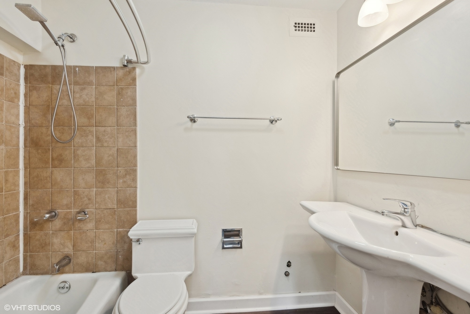 5445 North Sheridan Road, Unit 3812 Chicago, IL 60640 - Photo 13 of 21 a bathroom with a sink toilet and shower