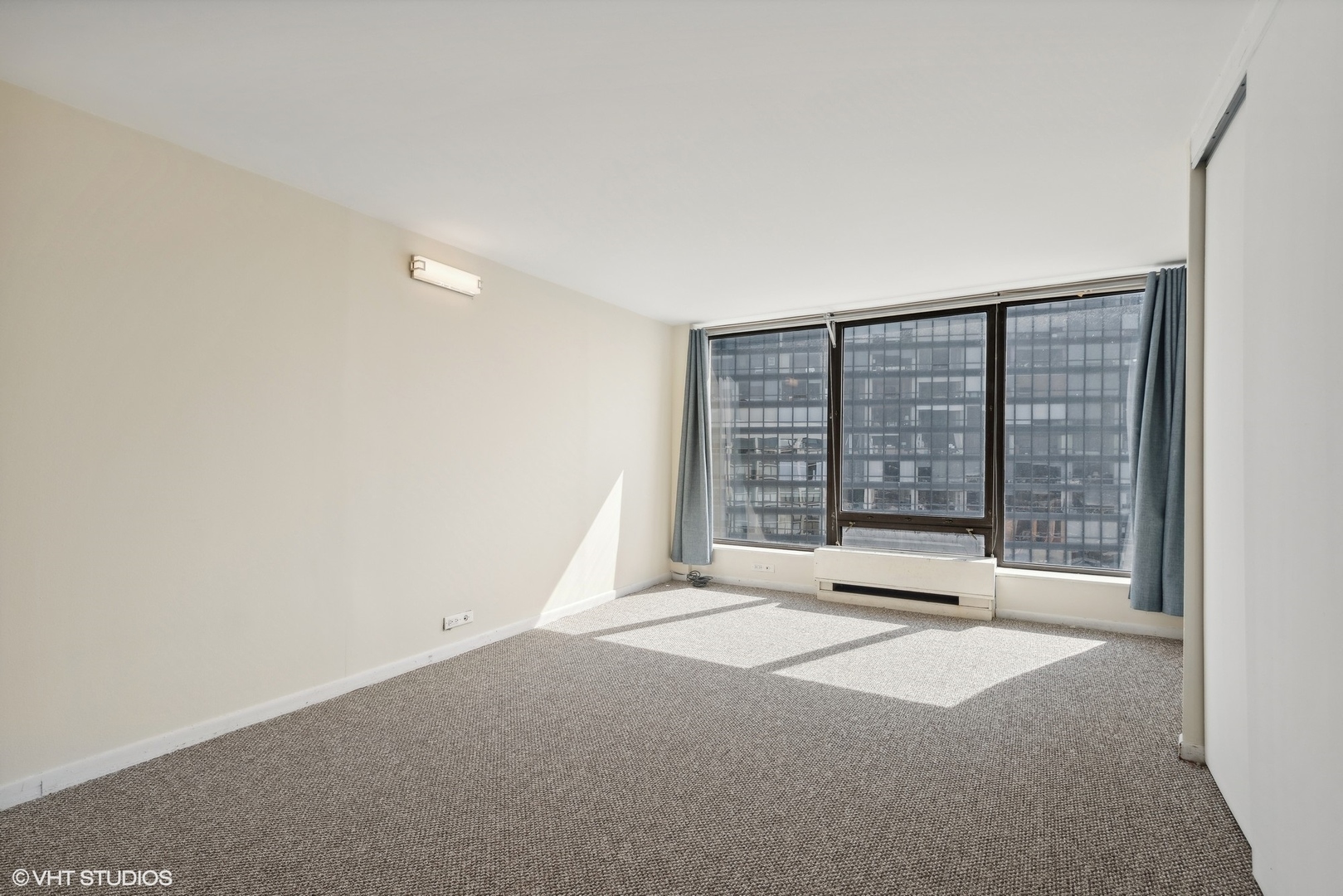 5445 North Sheridan Road, Unit 3812 Chicago, IL 60640 - Photo 18 of 21 a view of an empty room with a window