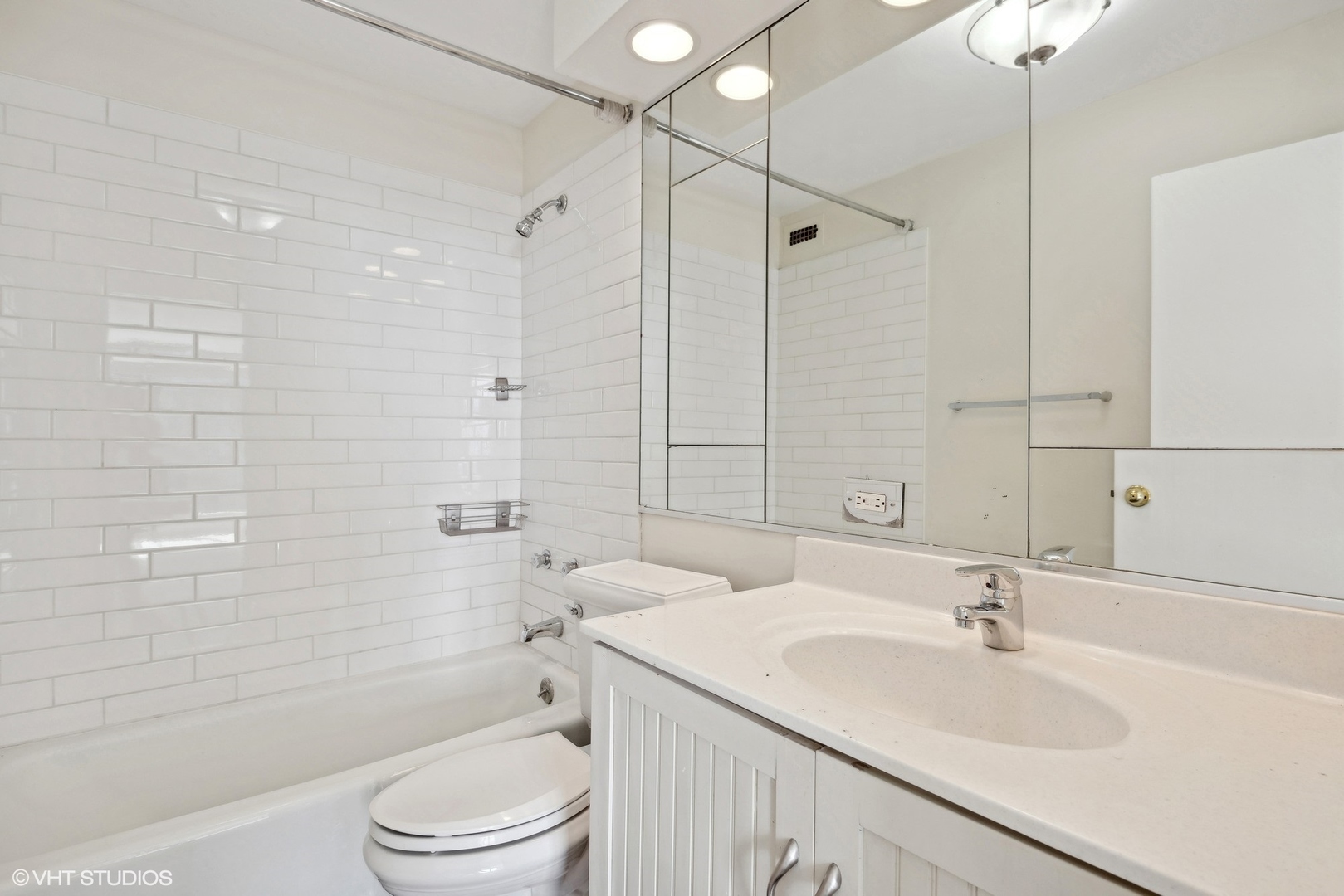 5445 North Sheridan Road, Unit 3812 Chicago, IL 60640 - Photo 20 of 21 a bathroom with a sink toilet vanity and shower