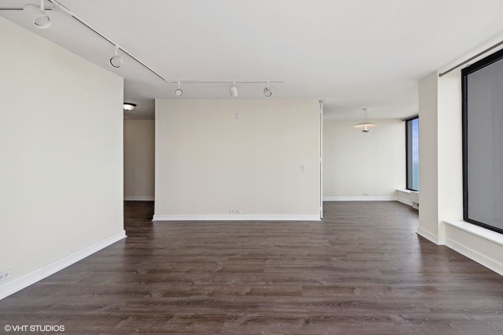 5445 North Sheridan Road, Unit 3812 Chicago, IL 60640 - Photo 5 of 21 a view of an empty room with wooden floor