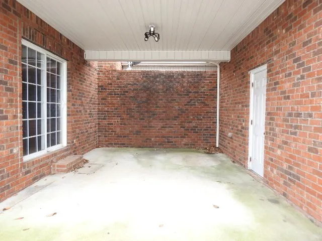 a view of empty room with windows
