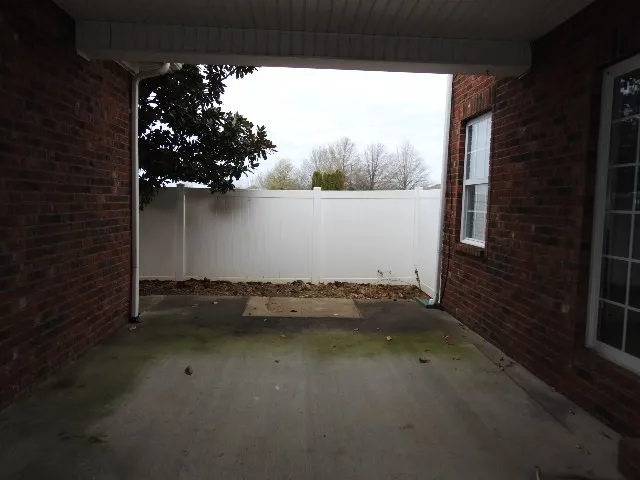 a view of balcony and yard