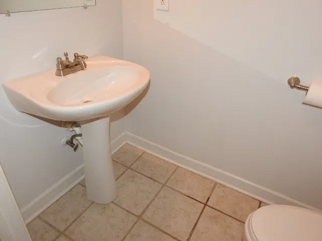 a bathroom with a sink and toilet