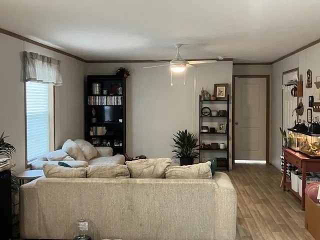 a living room with furniture window and bookshelf