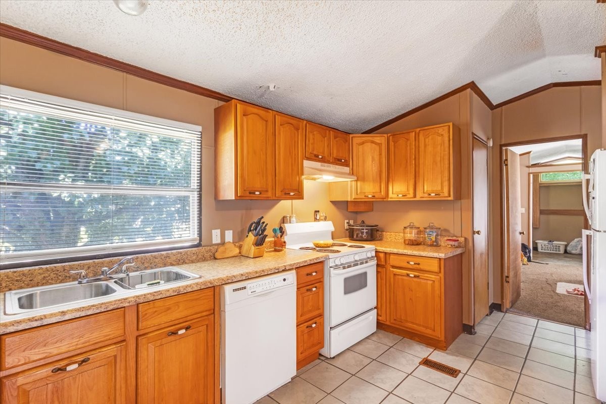 0 Ez Lane Manchester, TN 37355 - Photo 13 of 56 a kitchen with a sink stove and cabinets
