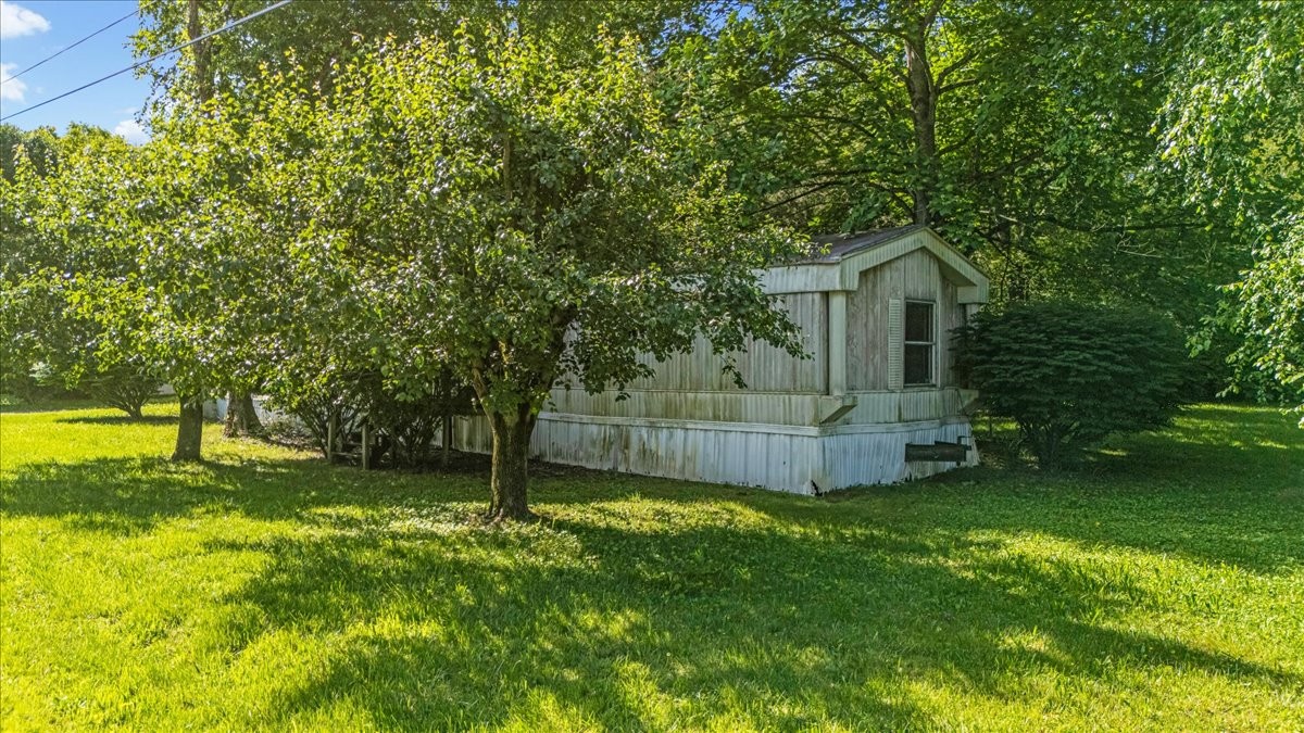 0 Ez Lane Manchester, TN 37355 - Photo 27 of 56 a view of a house with a backyard and a tree