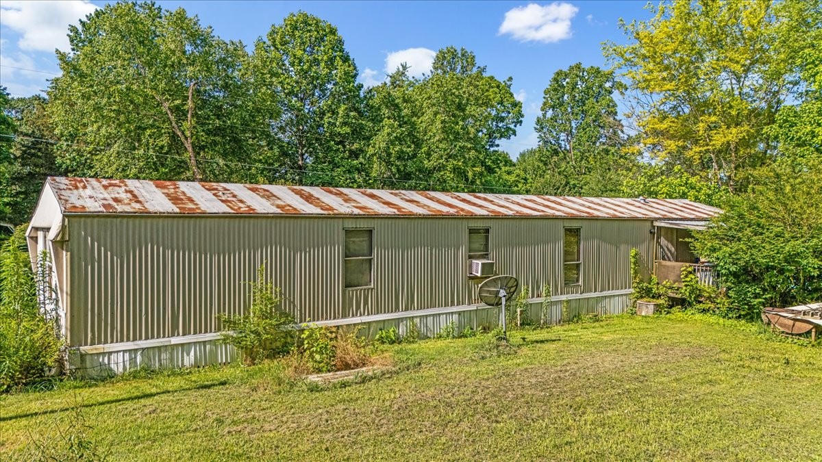 0 Ez Lane Manchester, TN 37355 - Photo 31 of 56 a backyard of a house with table and chairs
