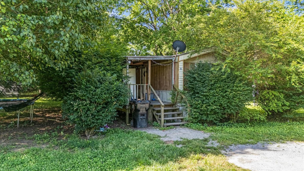 0 Ez Lane Manchester, TN 37355 - Photo 34 of 56 a backyard of a house with chairs and plants